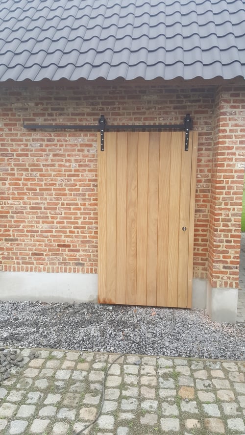 Afrormosia houten buitendeur geplaatst door schrijnwerker Bongaerts D. in Peer